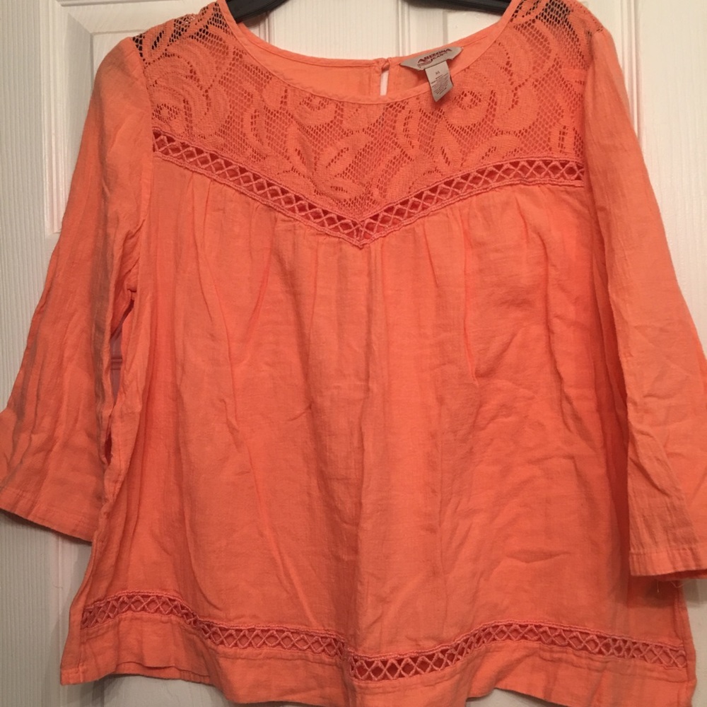 Bright peach blouse for any occasion!